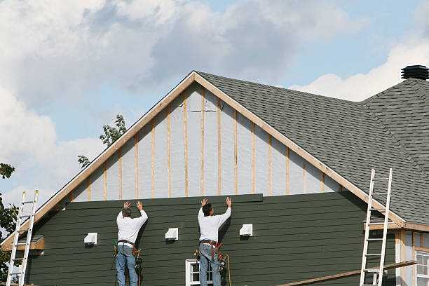 Professional Siding technician working in Freedom, PA